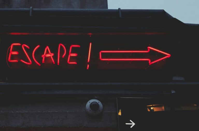 a red sign that says escape on it